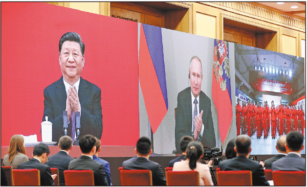 President Xi Jinping and his Russian counterpart Vladimir Putin witness the opening ceremony for the China-Russia east-route natural gas pipeline in a video conference on Monday. Feng Yongbin / China Daily