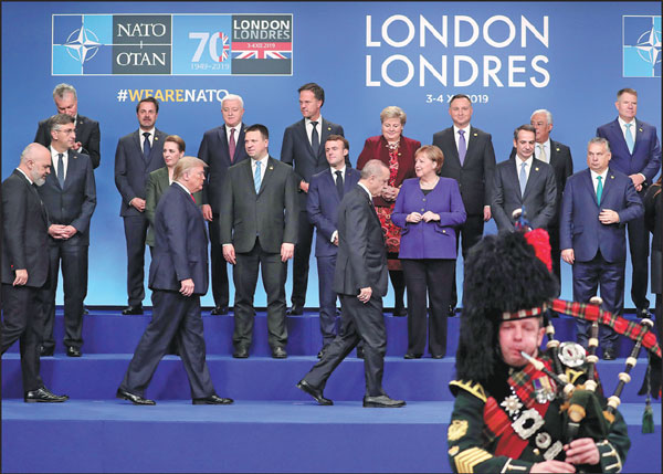 NATO leaders prepare for a group photo at the alliance’s summit in Watford, Britain, on Wednesday.