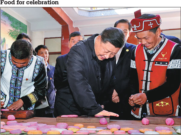 President Xi Jinping, who is also general secretary of the Communist Party of China Central Committee and chairman of the Central Military Commission, helps local residents prepare food for Chinese New Year in the Wa ethnic group village of Simola during an inspection tour in Tengchong, Yunnan province, on Sunday. Xi learned about local poverty alleviation efforts and extended New Year's greetings to the residents.Ju Peng/xinhua