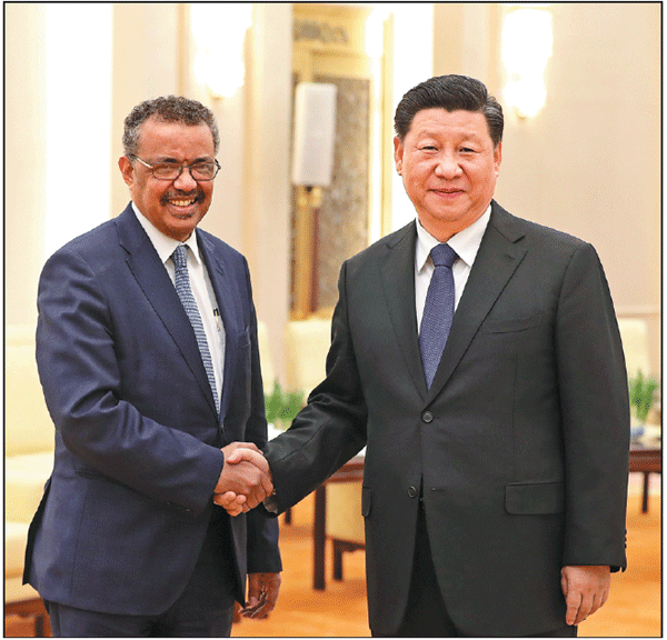 President Xi Jinping shakes hands with Tedros Adhanom Ghebreyesus, director-general of the World Health Organization, at the Great Hall of the People in Beijing on Tuesday. Feng Yongbin / China Daily