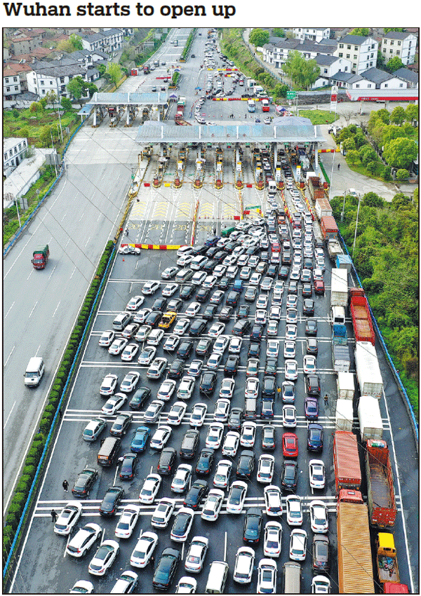Vehicles wait at a toll station for information verification and temperature checks on Wednesday as inbound traffic restrictions into Wuhan, Hubei province, are eased. Some outbound restrictions are set to be eased on April 8 for the Chinese city hardest hit by COVID-19. See story, Mei Tao / For China Daily page 3