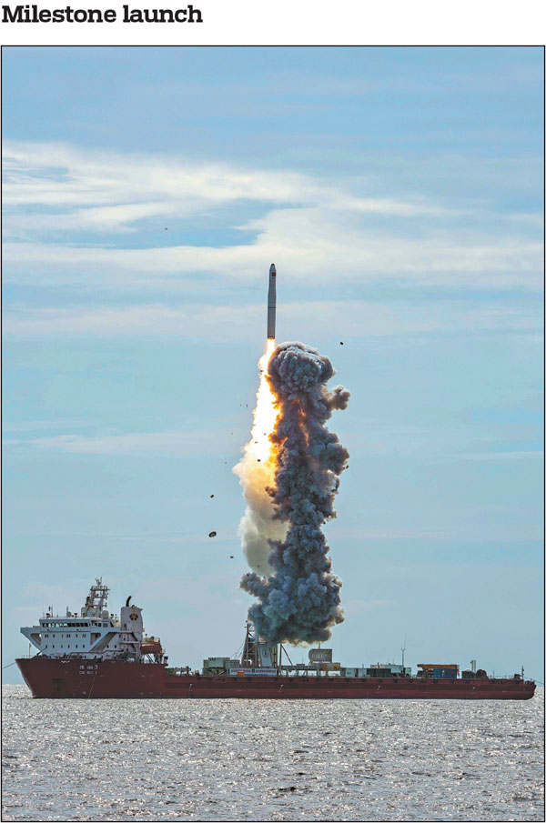 Nine satellites are launched atop a Long March 11 carrier rocket from a selfpropelled deck barge in the Yellow Sea on Tuesday, fulfilling China's first commercial launch at sea. Shi Xiao / For China Daily