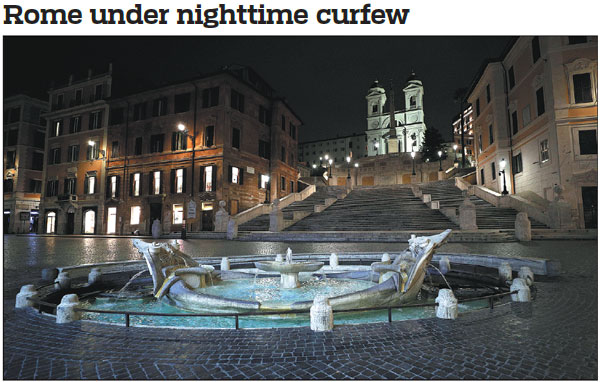 The Spanish Steps in Rome are deserted on Saturday after a curfew was imposed by Italy's Lazio region, of which Rome is the capital, between midnight and 5 a.m. to help curb the spread of COVID-19 infections. Guglielmo Mangiapane / Reuters