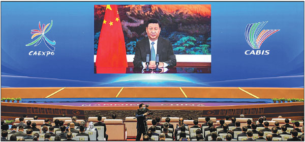 President Xi Jinping delivers a speech via video at the opening ceremony of the 17th China-ASEAN Expo and China-ASEAN Business and Investment Summit, which got underway on Friday in Nanning, the Guangxi Zhuang autonomous region.    Provided to China Daily