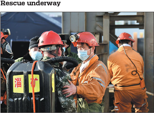 Rescue workers prepare to continue searching on Tuesday for 22 miners trapped underground after an explosion ripped through a gold mine under construction in Yantai, Shandong province. The explosion happened at 2 pm on Sunday. More than 300 rescue workers are participating in the mission to save the miners.Wang Kai/xinhua