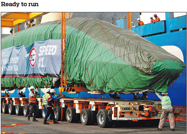 The lead car of a Chinese-made high-speed passenger train is loaded on a truck after arriving at a port in Jakarta, Indonesia, on Friday. A set of passenger trains and an inspection train arrived on the same day, preparing for the operation of the Jakarta-Bandung High-speed Railway, a landmark project of China-Indonesia cooperation under the Belt and Road Initiative. AJENG DINAR ULFIANA/REUTERS