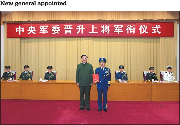 Xi Jinping, chairman of the Central Military Commission, poses with Wang Qiang, commander of the Northern Theater Command of the People's Liberation Army, after presenting a certificate at a ceremony to promote Wang to the rank of general. Xi extended his congratulations to Wang, who saluted Xi and all the attendees of the event, including CMC vice-chairmen Xu Qiliang and Zhang Youxia.Li Gang/Xinhua