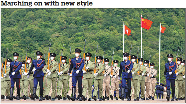 Hong Kong's Disciplined Services practice Chinese-style foot drill on Saturday during a grand parade in the special administrative region. The parade, organized by the Security Bureau of the SAR government, was held to celebrate the 73rd anniversary of the founding of the People's Republic of China.      Edmond Tang / China Daily