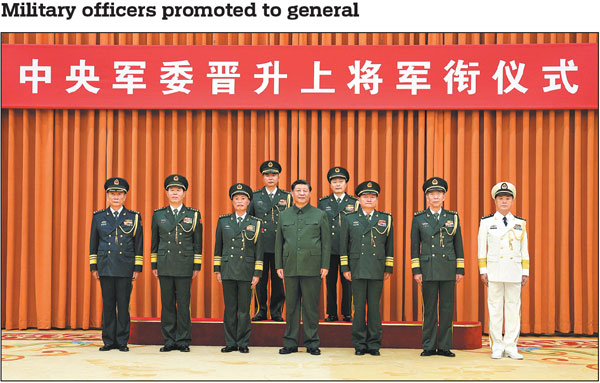 Xi Jinping (center), chairman of the Central Military Commission, takes a group photo with other military leaders and two military officers who were promoted to the rank of general at a ceremony in Beijing on Wednesday. The promoted officers are Zheng Xuan (back left), political commissar of the Northern Theater Command of the People's Liberation Army, and Ling Huanxin (back right), political commissar of the Academy of Military Sciences. Zhang Youxia (third right), vice-chairman of the CMC, announced at the ceremony the promotion order, which was signed by Xi. He Weidong (third left), another CMC vice-chairman, presided over the ceremony. Other members of the CMC, including Li Shangfu (second right), minister of national defense, Liu Zhenli (second left), Miao Hua (far right) and Zhang Shengmin (far left), also attended the ceremony.Li Gang/Xinhua