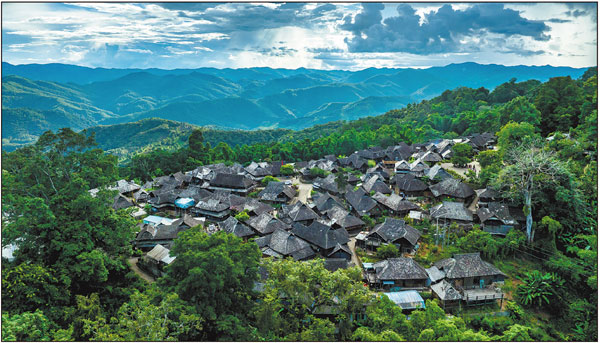 A village on Jingmai Mountain in Pu'er, Yunnan province, is seen in this photo taken on Aug 3. The region is well known for its old tea trees and early use of tea resources. JIANG WENYAO/XINHUA