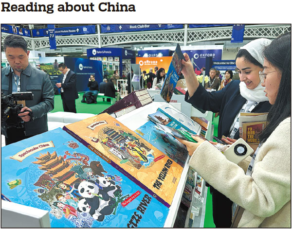People read at the China-themed section of the London Book Fair, which opened on Tuesday at the Olympia Exhibition Centre in London, United Kingdom. Around 50 Chinese publishers are showcasing more than 3,200 titles at this year's book event, which is scheduled to run through Thursday. OUYANG KAIYU/CHINA NEWS SERVICE