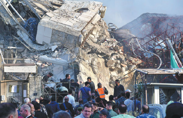 Rescuers work near the destroyed building of the Iranian consulate in Damascus, Syria, on Monday. At least 10 people were killed in the airstrikes on the building, according to the Iranian ambassador to Syria and other sources.Ammar Safarjalani/Xinhua