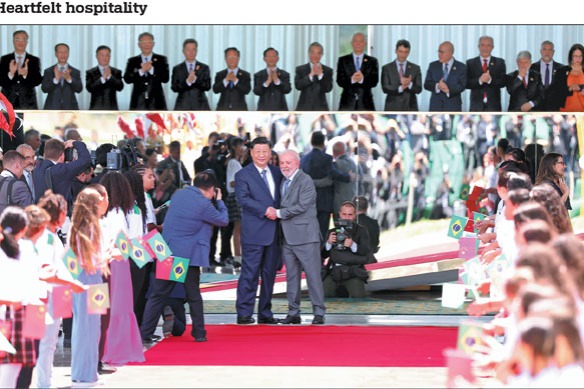 President Xi Jinping shakes hands with Brazilian President Luiz Inacio Lula da Silva during a grand welcoming ceremony held by Lula in Brasilia, the capital of Brazil, on Wednesday. Xi arrived in Brasilia on Tuesday for a state visit to Brazil after attending the 19th G20 Summit in Rio de Janeiro.Feng Yongbin/China Daily