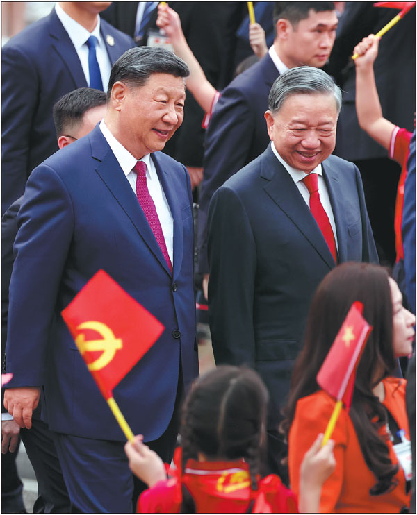 Xi Jinping, general secretary of the Communist Party of China Central Committee and Chinese president, attends in Hanoi on Monday a welcoming ceremony hosted by To Lam (right), general secretary of the Communist Party of Vietnam Central Committee. Xi is on a two-day state visit to Vietnam as part of his first tour abroad this year. He will also visit Malaysia and Cambodia before returning to China on Friday.Feng Yongbin/China Daily