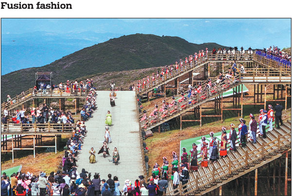 Professional models and local residents participate in a fashion show at the Wumeng Grass Plain Scenic Area in Liupanshui, Guizhou province, on Sunday. The event, which featured traditional costumes from the Yi, Miao, Bai, Bouyei and Dong ethnic groups, as well as contemporary ensemble, showcased the integration of ethnic culture and eco-tourism.Qiao Qiming/For China Daily
