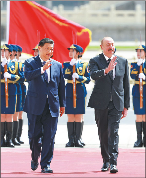 President Xi Jinping holds a welcoming ceremony for visiting Azerbaijani President Ilham Aliyev at the square outside the east gate of the Great Hall of the People prior to their talks in Beijing on Wednesday. Aliyev started his three-day state visit to China on Tuesday. FENG YONGBIN/CHINA DAILY