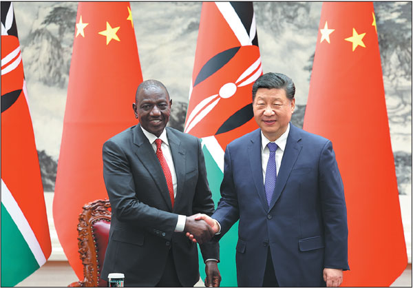 President Xi Jinping shakes hands with Kenyan President William Ruto on Thursday at the Great Hall of the People in Beijing. Xi held talks with Ruto, who started his five-day state visit to China on Tuesday.Wang Zhuangfei/China Daily