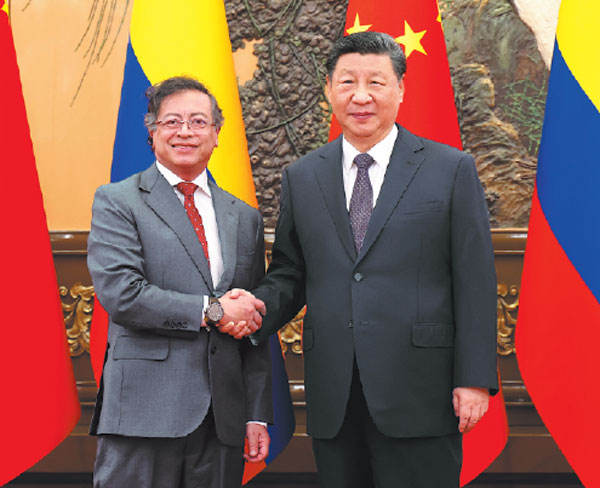 President Xi Jinping shakes hands with Colombian President Gustavo Petro on Wednesday during their meeting in Beijing.Feng Yongbin/China Daily