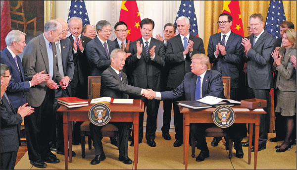 Vice-Premier Liu He and United States President Donald Trump shake hands after signing the China-US phase-one trade deal at the White House on Wednesday.Wang Ying/xinhua
