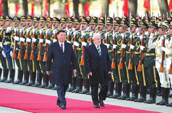 President Xi Jinping hosts a welcoming ceremony for visiting Brazilian President Luiz Inacio Lula da Silva before their talks at the Great Hall of the People in Beijing on Friday.Feng Yongbin/China Daily