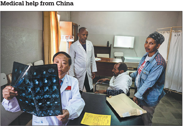 Doctor Zhu Zhenjun (left), who is head of the 16th Chinese medical team to Eritrea, diagnoses a patient at Halibet Hospital in Asmara, Eritrea, on May 9. Since the medical team's arrival in the East African country on April 17, the doctors have conducted 346 operations and 2,120 examinations for local patients. Nearly 300 Chinese doctors have provided medical services in Eritrea since 1997.Wang Guansen/Xinhua