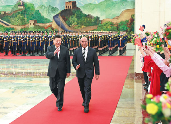 President Xi Jinping holds a grand welcoming ceremony for visiting Nauruan President David Adeang at the Great Hall of the People in Beijing on Monday.Feng Yongbin/China Daily