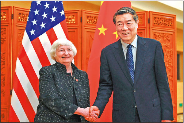 Vice-Premier He Lifeng shakes hands with US Treasury Secretary Janet Yellen in Guangzhou, Guangdong province, on Friday. PEDRO PARDO/AFP