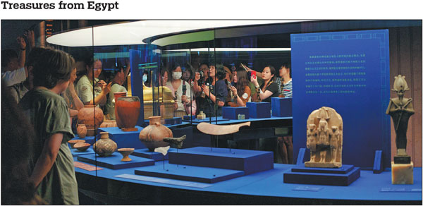 Guests attend on Tuesday a media preview of an exhibition, titled On Top of the Pyramid: The Civilization of Ancient Egypt, at the Shanghai Museum. A total of 788 artifacts from various eras of ancient Egypt are on display, with over 95 percent of them being exhibited in Asia for the first time. The exhibition opens to the public on Friday and will run until Aug 17, 2025. It marks the first comprehensive collaboration between a Chinese museum and the Egyptian government.Gao Erqiang/China Daily