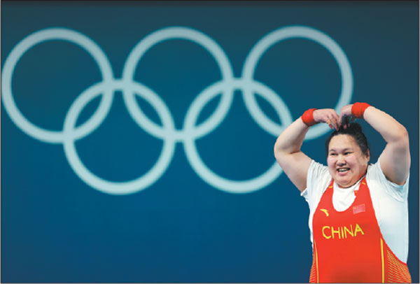 Li Wenwen of China makes a celebratory gesture on Sunday after winning the women's +81kg weightlifting gold at the Olympic Games in Paris, France.Wei Xiaohao/China Daily
