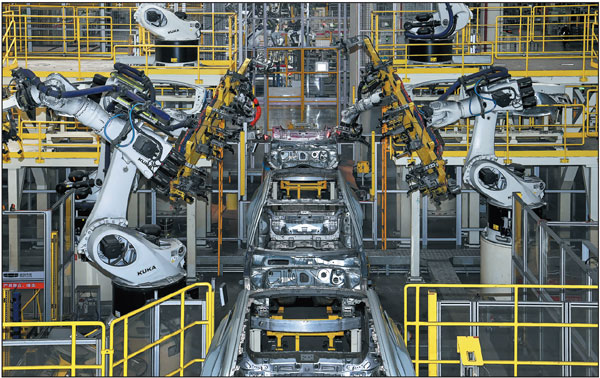 An automated welding line operates at Geely Automobile's manufacturing base in Baoji, Shaanxi province, on Feb 26. In recent years, Baoji, a major industrial city in western China, has stepped up efforts to promote the high-end and intelligent development of key equipment manufacturing for industries such as machine tools, rail transit and petroleum.Zou Jingyi/Xinhua
