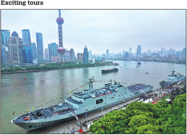 Two vessels of the People's Liberation Army Navy - amphibious transport dock Yimengshan and guided-missile destroyer Xi'an - open to the public in Shanghai on Tuesday. Over 30 active naval ships are currently on display in more than 10 coastal cities and ports to mark the 76th anniversary of the founding of the PLA Navy, which is on Wednesday. Liang Yan / For China Daily